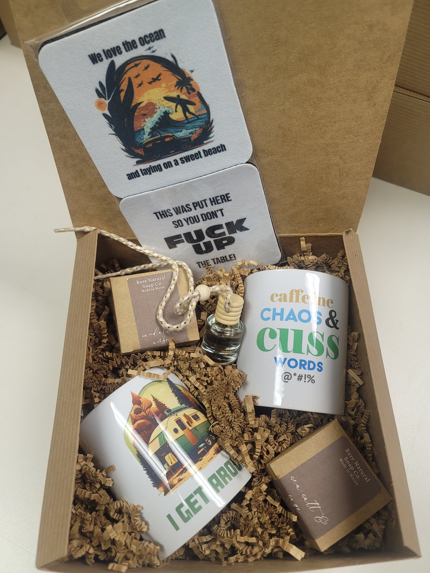 Gift set with mugs, coasters, and 2 car diffuser air fresheners in a gift box.