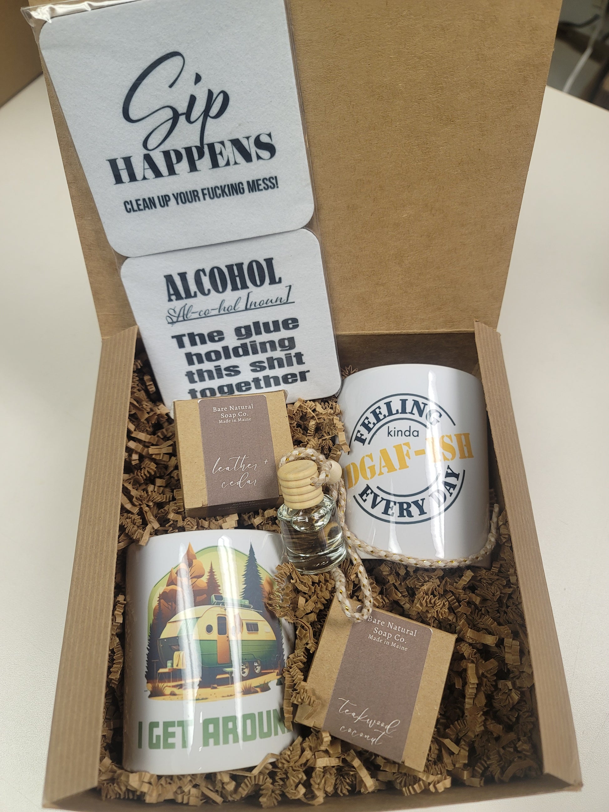 Gift set with mugs, coasters, and 2 car diffuser air fresheners in a gift box.
