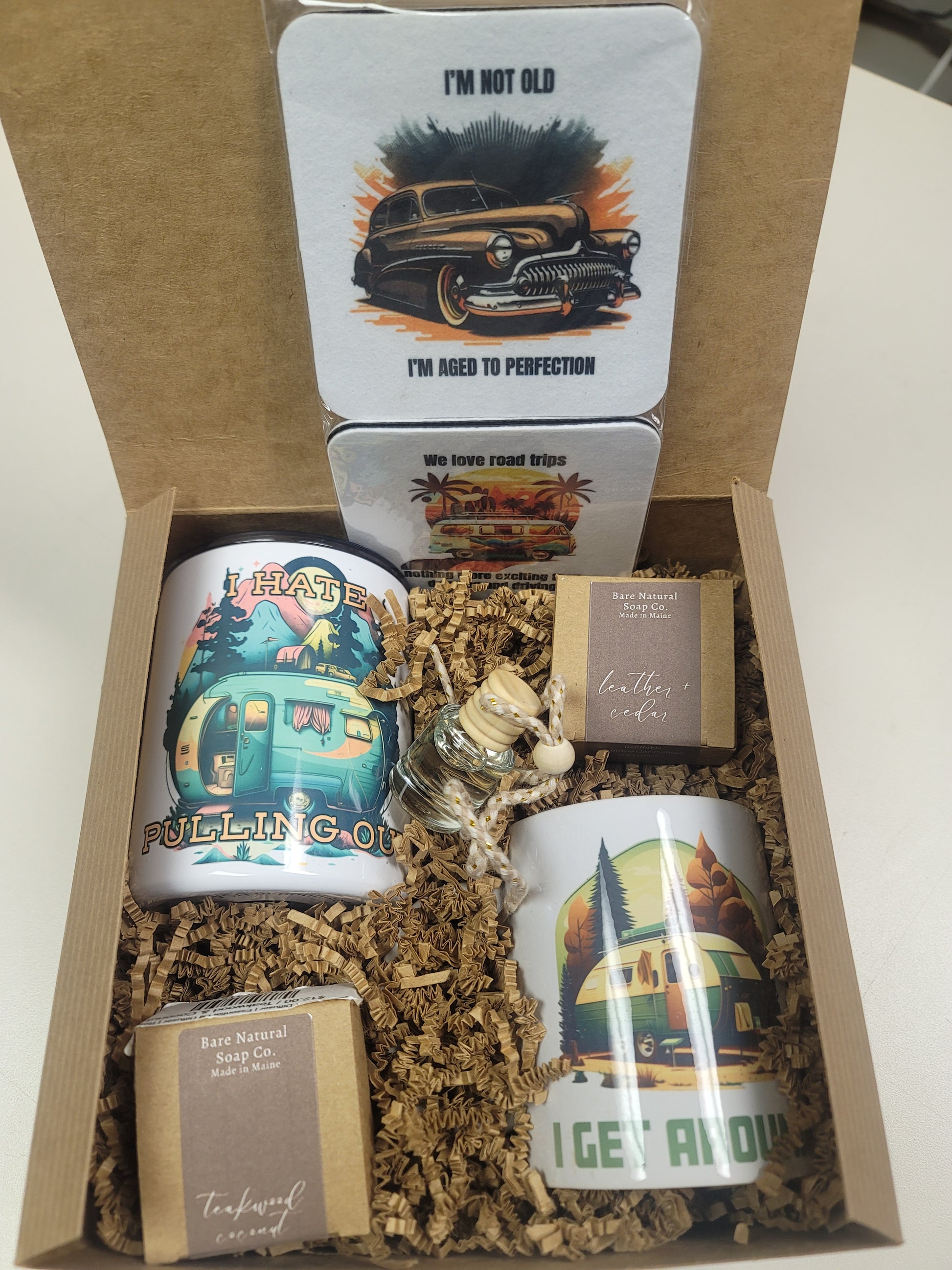 Gift set with mugs, coasters, and 2 car diffuser air fresheners in a gift box.